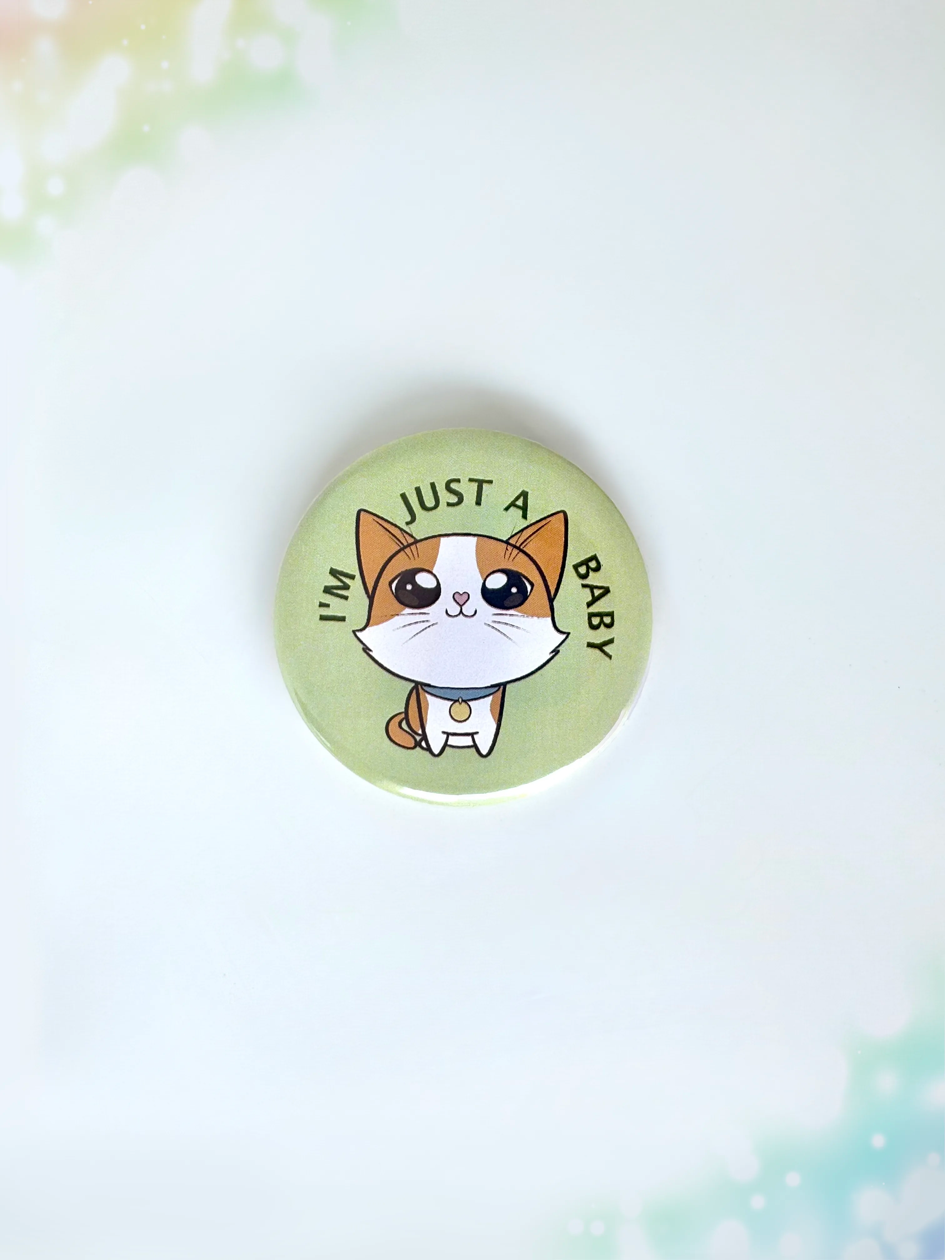 Adorable crying kitten aesthetic button badge with the text I'm Just A Baby.