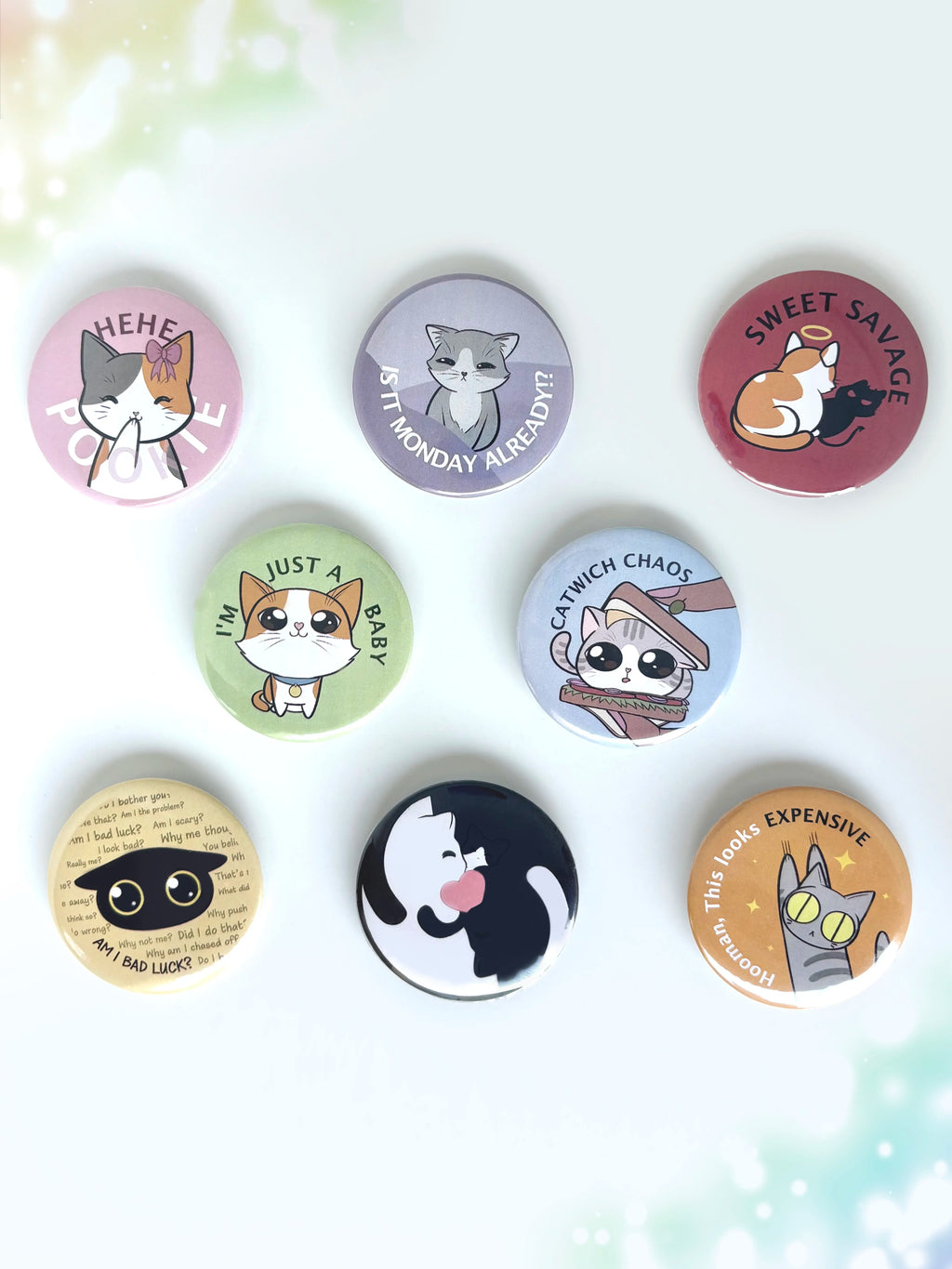 A collection of cute cat button badges displayed together on a clean white background.