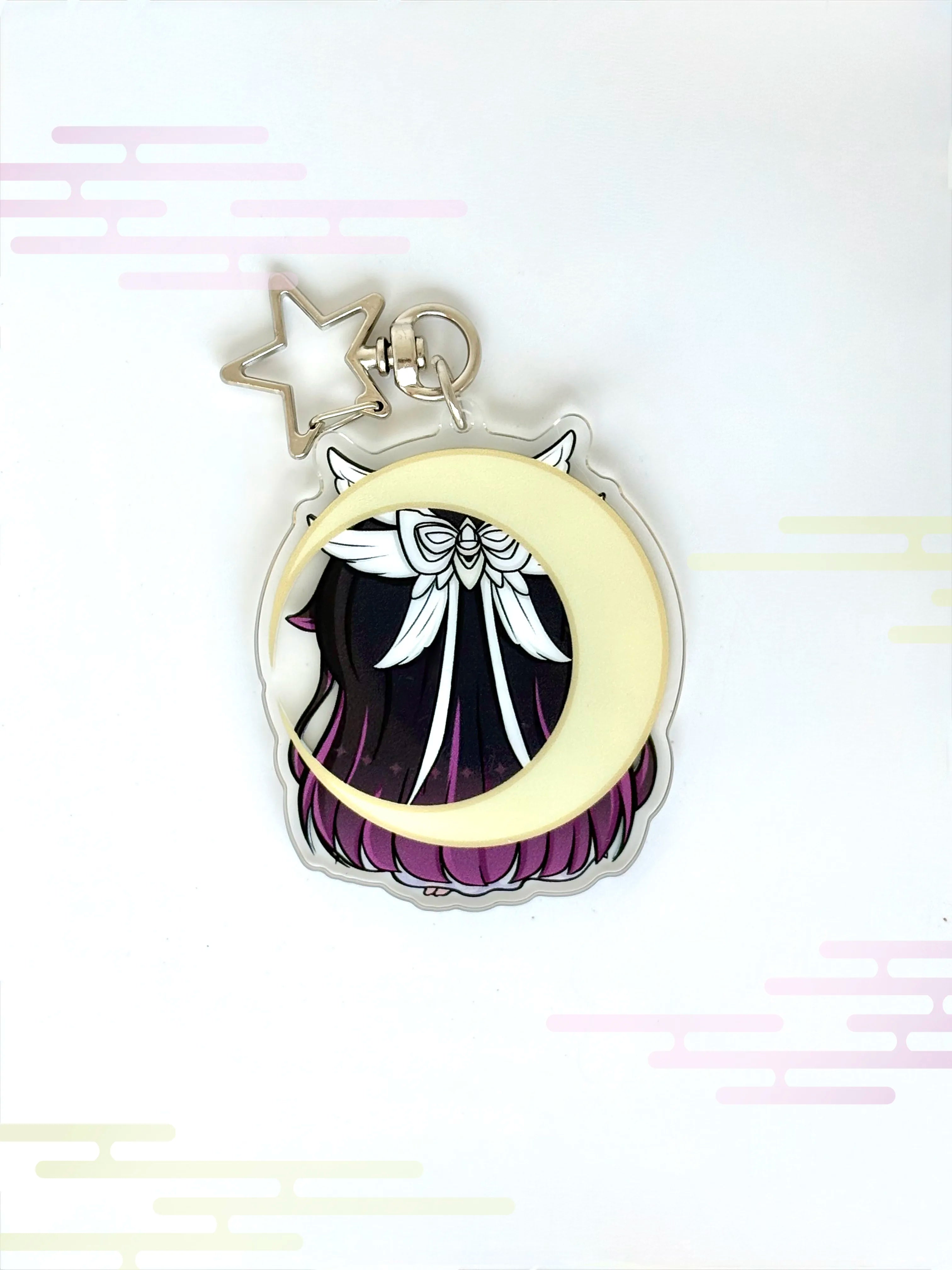 Back view of the Columbina anime keychain showcasing a unique alternate art illustration.