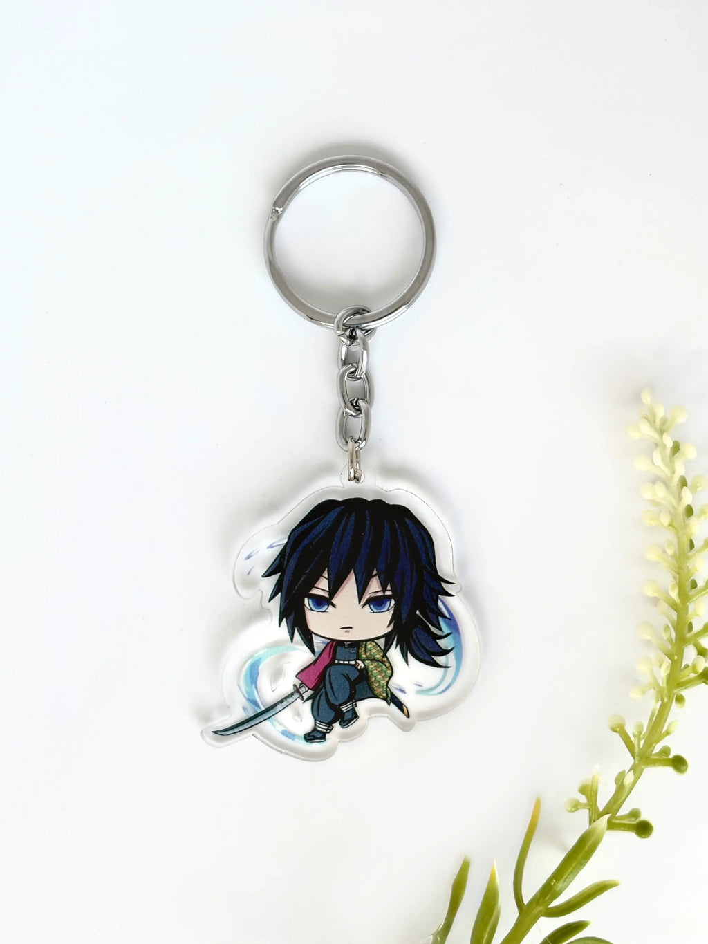 Giyu Tomioka fanmade acrylic anime keychain placed on a white background