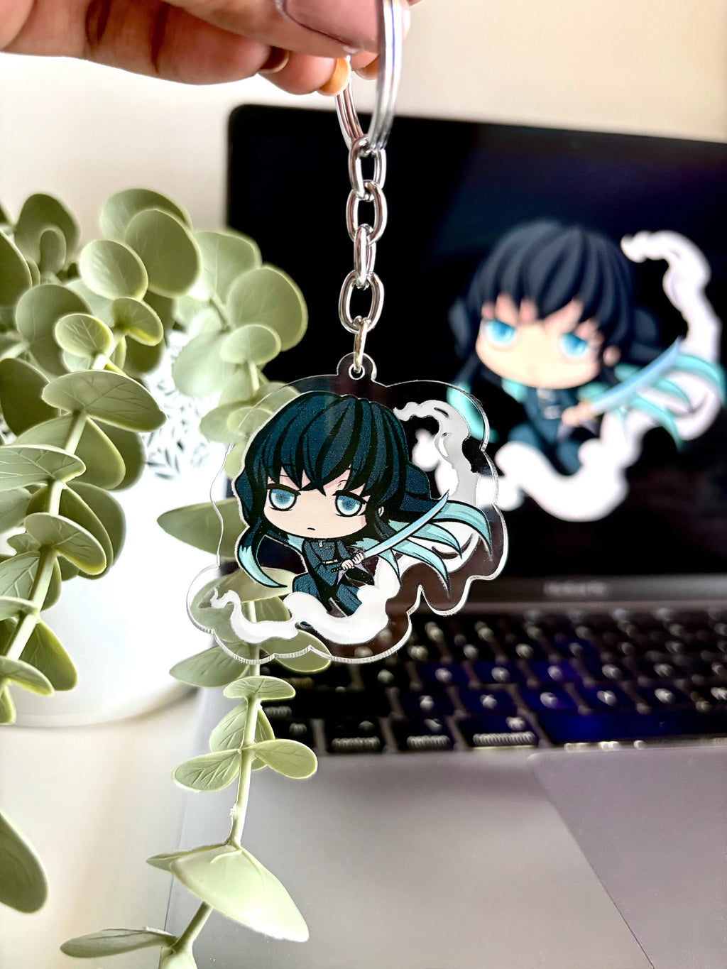 Muichiro Tokito fanmade acrylic anime keychain held in hand