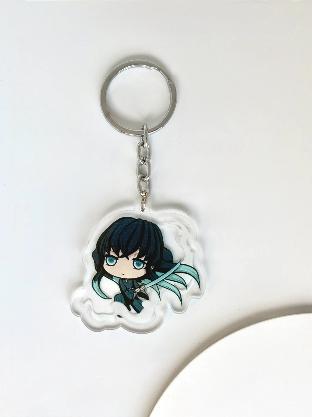 Muichiro Tokito fanmade acrylic anime keychain placed on a white background